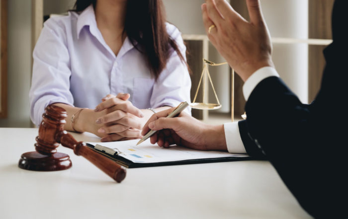 An attorney reviews a case with a client